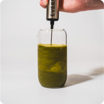 everyday dose matcha blend being mixed in cup