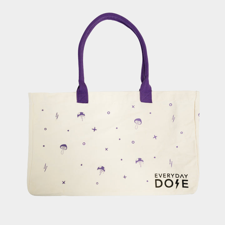 Events Tote Bag featuring cream canvas with purple handles and playful mushroom pattern with lightning bolt accents