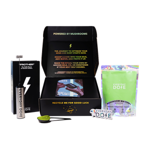 Mushroom Matcha starter kit with black box, green powder packet and metal water bottle against white background