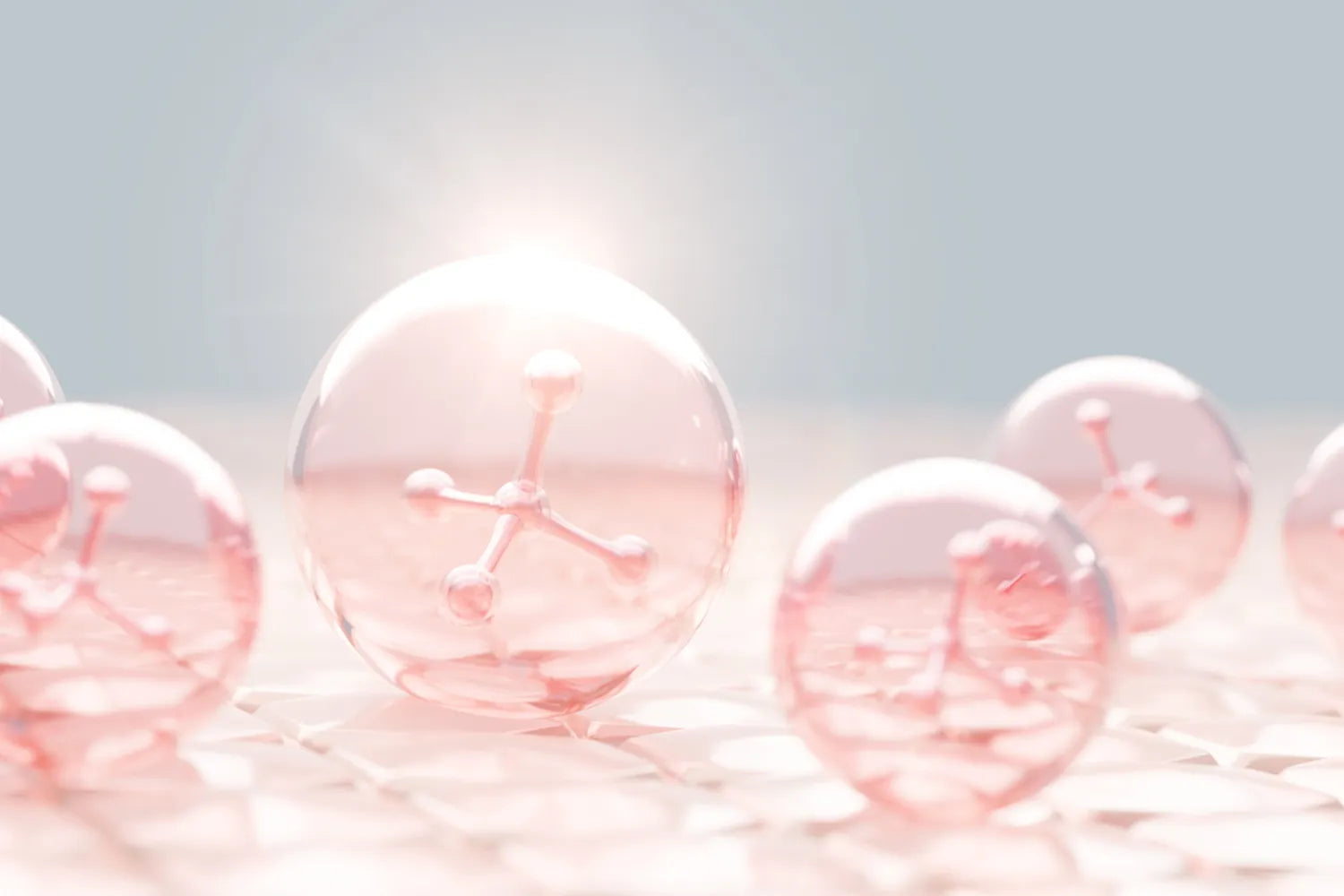 Pink translucent collagen spheres resting on a pale tiled surface with stylized molecular structures and soft backlighting