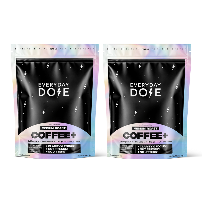 Two black pouches of medium roast coffee with holographic edges and white lightning bolt designs