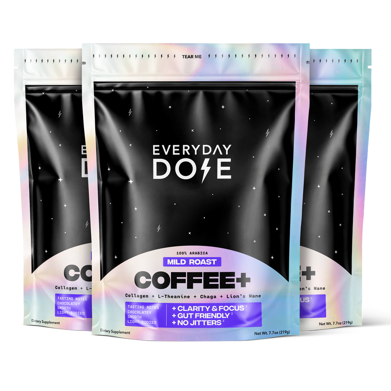 Three holographic coffee supplement packages with black labels and purple accents for mild roast blend