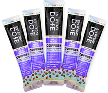 Five Everyday Dose Mild Roast coffee sticks arranged in landscape with purple and black packaging, gallery position one