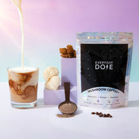 Everyday Dose Mushroom Coffee+ starter kit with creamy pour, coffee beans, and powder on pastel background