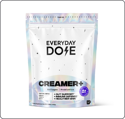 White pouch with holographic accents labeled Everyday Dose Creamer+ featuring collagen, probiotics, and health benefits text