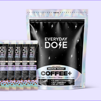 Front view of Everyday Dose Coffee+ pouch and five stick packs showcasing the pouch front label on pale purple background