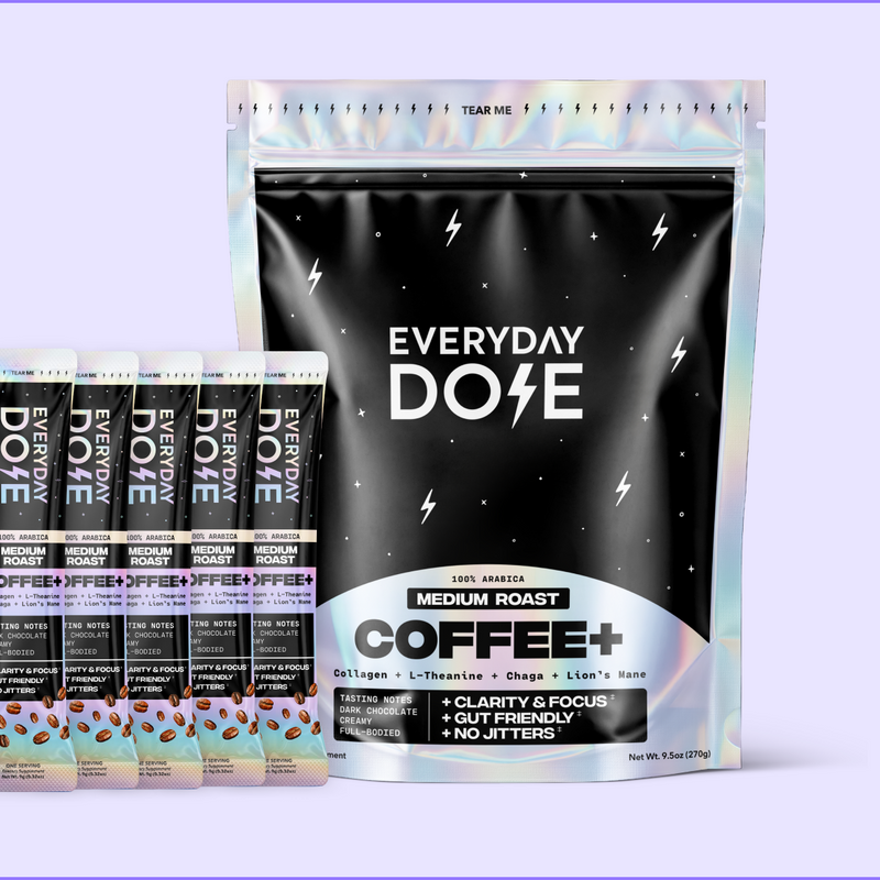 Front view of Everyday Dose Coffee+ pouch and five stick packs showcasing the pouch front label on pale purple background